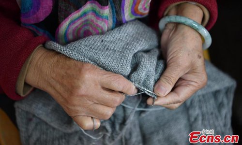 Old ladies knit sweaters for children in poor areas in Kunming, Southwest China's Yunnan province on November 1, 2018. The ladies, who are retirees of a local hospital, formed a knitting club to make and send out cozy sweaters for the needy. A total of 19 knitters, whose average age is 75, have worked tirelessly in the past nine months, knitting 184 warm sweaters in their spare time for needy children in a village in Qiaojia county of the province. (Photo: China News Service/ Liu Ranyang)
