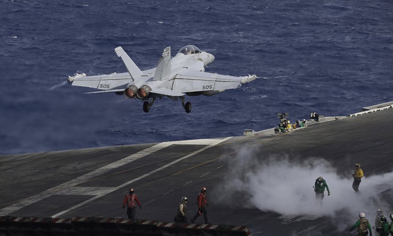 An F/A-18 Super Hornet fighter jet takes off on the deck of the US Navy USS Ronald Reagan in the South China Sea on Tuesday. China is allowing a US Navy aircraft carrier and its battle group to make a port call in Hong Kong Special Administrative Region after it turned down similar request in September. Photo: AP