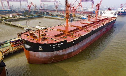 Shanghai Waigaoqiao Shipbuilding Co delivers a 400,000-ton very large ore carrier (VLOC) to China Merchants Energy Shipping Co on Wednesday. The ship, named Pacific Vision, is 362 meters long and 65 meters wide. It measures 30.4 meters from the hull to the top, with a maximum capacity of 400,000 tons. The ship will be used to transport iron ore between Brazil and China. Photo: VCG