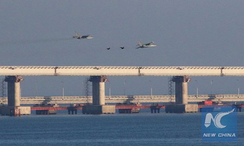 Russian jet fighters fly over a bridge connecting the Russian mainland with the Crimean Peninsula after three Ukrainian navy vessels were stopped by Russia from entering the Sea of Azov via the Kerch Strait in the Black Sea, Nov. 25, 2018. (REUTERS PHOTO)