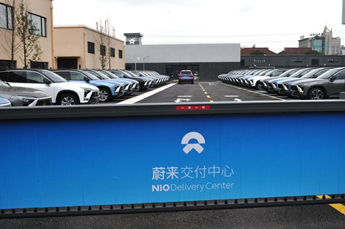 NIO electric cars are lined up at the NIO Delivery Center in Shanghai on Monday. The delivery center is the first of its kind in Shanghai, where potential customers can view NIO SUV models. There is also a test drive area. The Tencent-backed electric car start-up successfully completed its initial public offering in the US on September 12, and has been described as Chinese rival to Tesla. Photo: VCG
