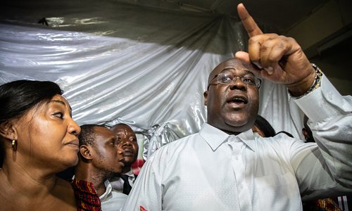 The Democratic Republic of Congo's newly elected President Felix Tshisekedi, surrounded by his wife and relatives from his party Union for Democracy and Social Progress, gestures a few minutes after the announcement of results by the Independent National Electoral Commission on Thursday. Photo: AFP