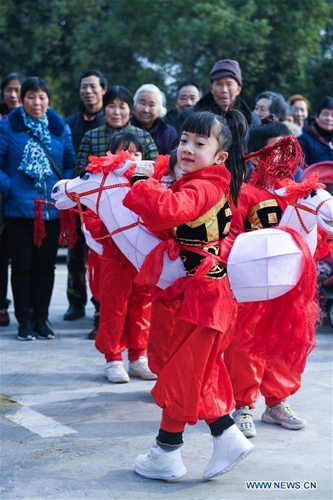 Children perform traditional folk dance to greet Spring Festival in ...