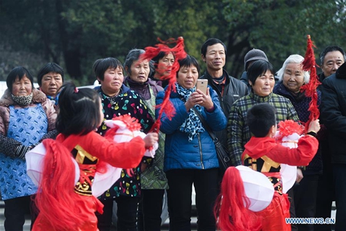 Children perform traditional folk dance to greet Spring Festival in ...