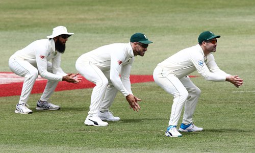 South African fielders (from left) Hashim Amla, Faf du Plessis and Dean Elgar play on Day 2 of the first Test match between South Africa and Sri Lanka held at the Kingsmead Stadium in Durban, on Thursday. Photo: AFP