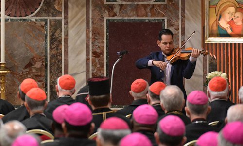 A victim of abuse, who wished to remain anonymous, plays the violin after delivering his testimony before the Pope and an assembly of cardinals and bishops, during a liturgical prayer within the third day of a landmark Vatican summit on tackling pedophilia in the clergy, on Saturday at the Vatican. Photo: AFP