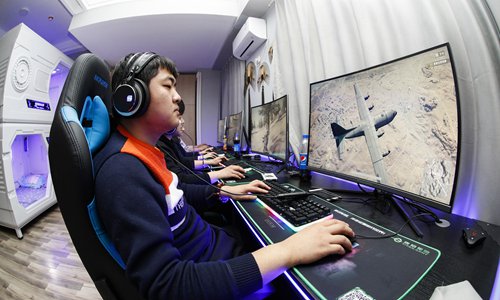Young Chinese play online video games in an esport hotel. Photo: VCG