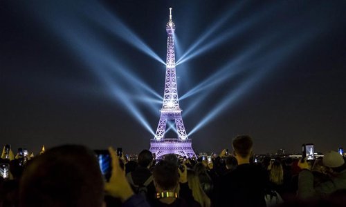 A light show is performed on the Eiffel Tower to celebrate its 130th anniversary in Paris, France, May 15, 2019. Built in Paris for then world's fair, the Eiffel Tower has become the pride and symbol of France. (Photo: Xinhua)