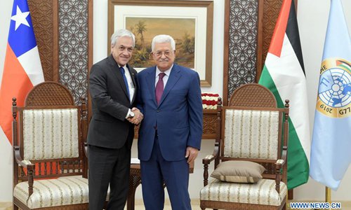 Palestinian President Mahmoud Abbas (R) shake hands with visiting Chilean President Sebastian Pinera in the West Bank city of Ramallah, on June 27, 2019. (Xinhua/Office of the Presidency/Stringer) 