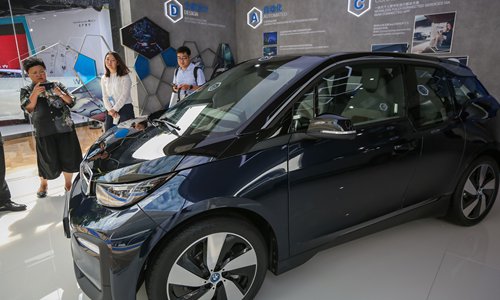 Visitors look at a new-energy vehicle on the sidelines of the 2019 World New Energy Vehicles Congress in Bo’ao, South China’s Hainan Province on Monday. Photo: VCG