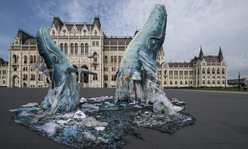 Whale sculptures made from plastic waste recovered from the ocean are on display at the parliament building in Budapest, Hungary on Tuesday. The temporary installation was erected as part of the international environmental movement 