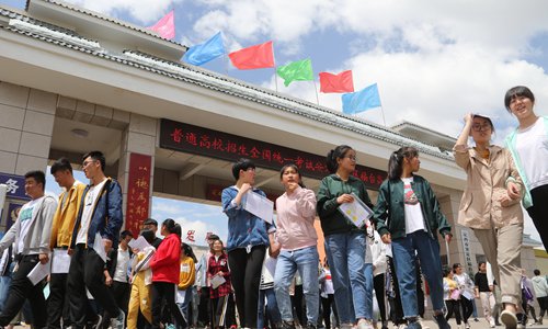 Students walk out of a school where they had sat a 2019 Gaokao exam. Photo: IC