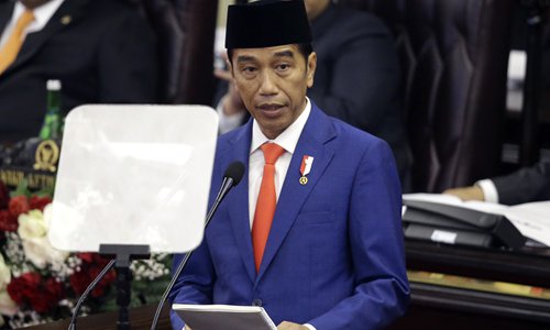 Indonesian President Joko Widodo delivers his state of the nation address ahead of the country's Independence Day in parliament, in Jakarta on Friday. In his address, Widodo asked parliament to sign off on proposals to move the nation's capital from Jakartato to Borneo island. Photo: AP