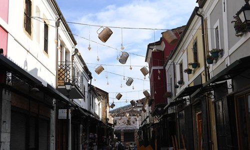 Photo taken on Aug. 17, 2019 shows a street decorated with beer mug models during the Korca Beer Festival in Korca, Albania. The Korca Beer Festival kicked off in the city of Korca, some 160 kilometers southeast of Albanian capital Tirana on Aug. 14. The festival is the biggest beer event in Albania that is held every year in mid-August and lasts for five days. (Xinhua/Zhang Liyun) 