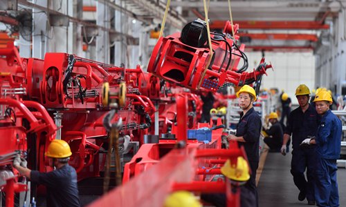 Employees work in a factory of SANY Heavy Industry Co, in Changsha, capital of Central China's Hunan Province. Photo: IC