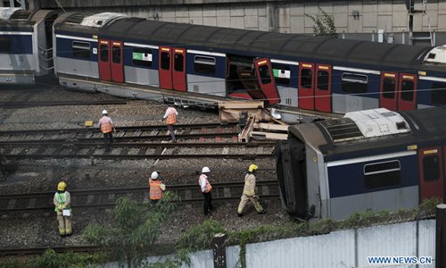 Train services partially resumed one day after derailment in Hong Kong ...
