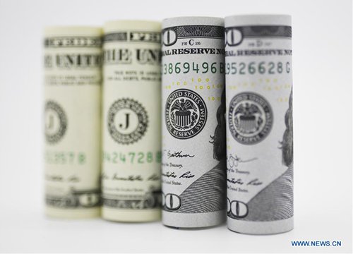 Photo taken on Sept. 18, 2019 shows US dollar banknotes in Washington D.C., the United States. US Federal Reserve on Wednesday lowered interest rates by 25 basis points amid growing risks and uncertainties stemming from trade tensions and a global economic slowdown, following a rate cut in July that was its first in more a decade. (Photo: Xinhua)