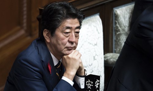 Japan's Abe sends ritual offering to Yasukuni Shrine, with cabinet ...
