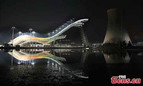 Big Air Shougang, the venue for Beijing 2022 Winter Olympic Games in Beijing, lit up on Nov. 28, 2019. The only snow event venue in the downtown area for the Beijing 2022 Winter Olympic Games, Big Air Shougang will host an FIS Freestyle Ski and Snowboard World Cup competition from Dec. 10 to 14. Photo: China News Service