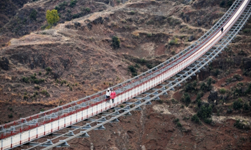Local government replaces cableway with bridge along Niulan River in SW ...