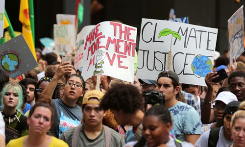 People participate in a strike to call attention to climate change in Chicago, the United States, on Sept. 20, 2019. (Xinhua/Wang Ping)