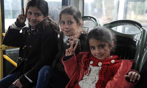 Syrian refugees returning from Lebanon are seen in a bus at the Jdaidet Yabous border crossing, west of Damascus, Syria, on Dec. 26, 2019. Around 1,400 Syrian refugees returned to their homeland from different areas in Lebanon on Thursday, Lebanese media reported. Photo: Xinhua