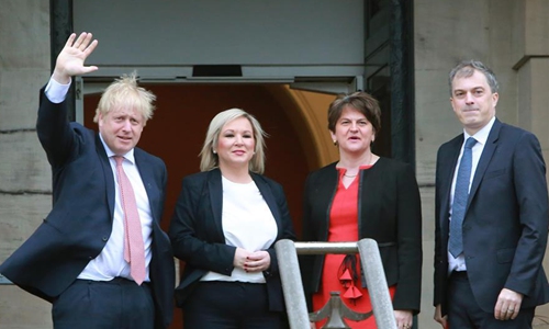 British Prime Minister Boris Johnson (1st L) and British Secretary of State for Northern Ireland Julian Smith (1st R) are greeted by Northern Ireland First Minister Arlene Foster (2nd R) of the Democratic Unionist Party (DUP) and Deputy First Minister Michelle O'Neill of Sinn Fein in Belfast, Northern Ireland, the United Kingdom, on Jan. 13, 2020. Boris Johnson said Monday during a visit to Belfast, Northern Ireland that he hopes and is confident to secure a zero-tariff, zero-quota agreement with the European Union (EU). Photo:Xinhua