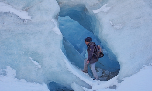 Wang Xiangjun explores a glacier in Bomi county, Southwest China's Tibet Autonomous Region in November 2017. Photo: Courtesy of Wang Xiangjun