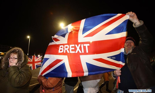 Pro-Brexit supporters celebrate Brexit outside Stormont in east Belfast, Northern Ireland, Britain on Jan. 31, 2020. Britain officially left the European Union (EU) at 11 p.m. (2300 GMT) Friday, putting an end to its 47-year-long membership of the world's largest trading bloc. (Photo by Paul McErlane/Xinhua)