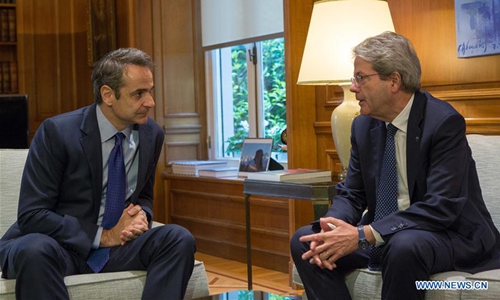 Greek Prime Minister Kyriakos Mitsotakis (L) meets with European Commissioner for Economy Paolo Gentiloni in Athens, Greece, on Feb. 6, 2020. Gentiloni is on a two-day visit to the Greek capital as part of his tour across European capitals in the context of the EU's regular schedule of coordination among member states on economic policy. (Xinhua/Marios Lolos)