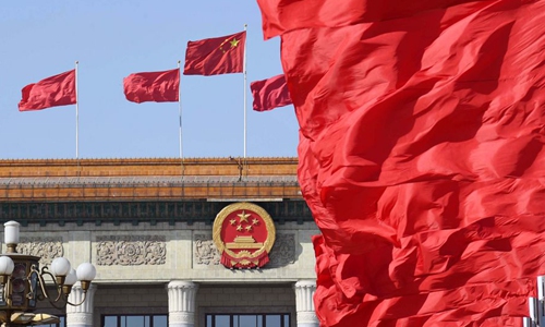 Flags are seen at the Tian'anmen Square and atop the Great Hall of the People during the opening meeting of the second session of the 13th National People's Congress in Beijing, capital of China, March 5, 2019. (Xinhua/Yang Zongyou)