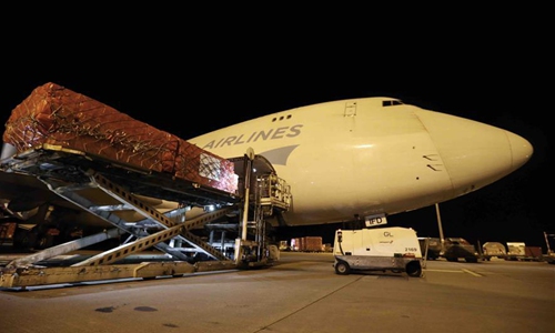 Chinese medical supplies on COVID-19 for Europe are unloaded at the airport of Liege in Belgium, on March 13, 2020. A plane carrying Chinese medical supplies for Europe, including face masks and testing kits on COVID-19, landed here on Friday night. (Xinhua/Zheng Huansong)