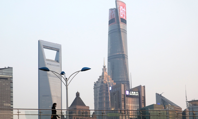A resident walks through the overpass at Lujiazui area of Pudong, one of the influential financial centers in China. Photo: Yang Hui/GT