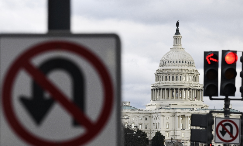 Red lights and No U-Turn signs are seen in front of Capitol Hill in Washington D.C., the United States, on Jan. 24, 2019.Photo:Xinhua