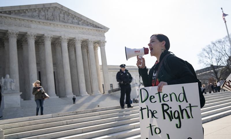 A small group of activists from BAMN (Coalition to Defend Affirmative Action, Integration & Immigrant Rights, and Fight for Equality By Any Means Necessary) protest outside the US Supreme Court in Washington DC on March 2. Photo: AFP