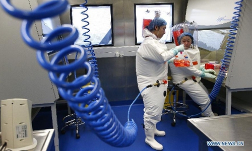Researchers take part in a drill at P4 lab in Wuhan, capital of Central China's Hubei Province. Photo: Xinhua