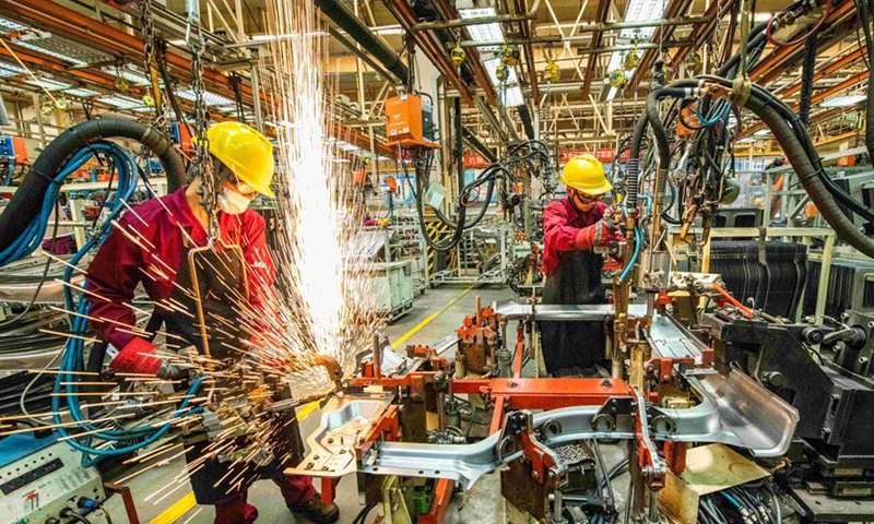 Workers weld at a workshop of an automobile manufacturing enterprise in Qingzhou City, east China's Shandong Province, June 30, 2020. The purchasing managers' index (PMI) for China's manufacturing sector ticked up to 50.9 in June from 50.6 in May, the National Bureau of Statistics said Tuesday. (Photo by Wang Jilin/Xinhua)
