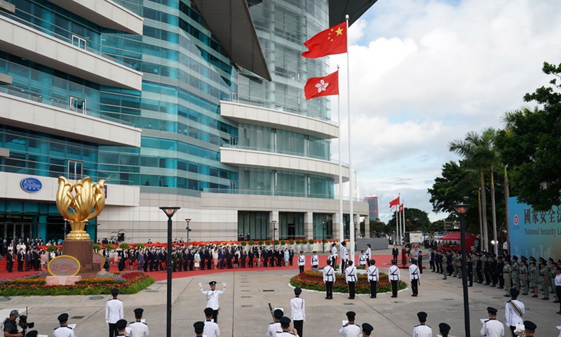 A flag-raising ceremony is held by the government of the Hong Kong Special Administrative Region to celebrate the 23rd anniversary of Hong Kong's return to the motherland at the Golden Bauhinia Square in Hong Kong, south China, July 1, 2020. (Xinhua/Li Gang)