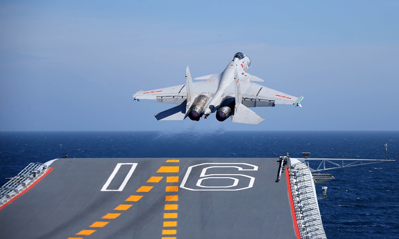 A J-15 carrier-borne fighter jet takes off from the flight deck of the aircraft carrier <em>Liaoning</em> during a maritime training exercise on July 1, 2017. The Chinese aircraft carrier <em>Liaoning</em> and its carrier strike group carried out realistic training in an undisclosed sea area on July 1, 2017. (eng.chinamil.com.cn/Photo by Li Tang)