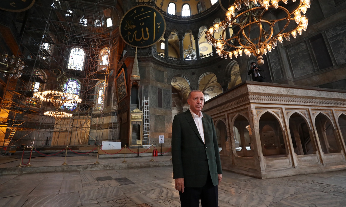 This picture shows Turkish President Tayyip Erdogan visiting Hagia Sofia on Sunday. Photo: AFP