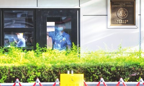 A security guard looks out of the window at the US Consulate General in Chengdu, Southwest China's Sichuan Province, on Sunday.  China has ordered the consulate to cease operations on Monday morning in retaliation for US' closure of China's Consulate General in Houston. Photo: Cui Meng/GT