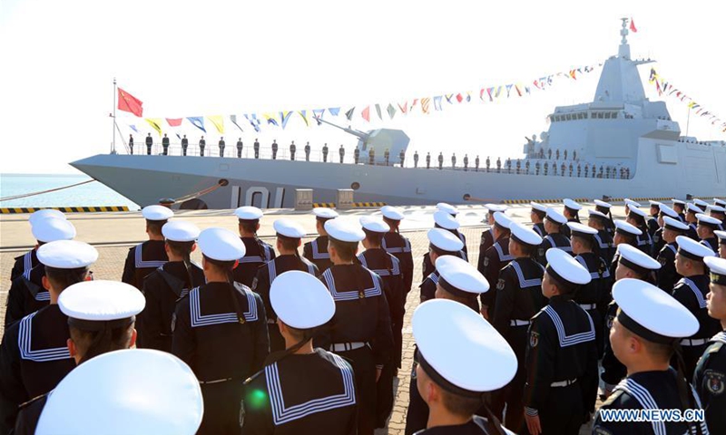 Photo taken on Jan. 12, 2020 shows the ceremony of the commissioning of the <em>Nanchang</em>, China's first Type 055 guided-missile destroyer, in the port city of Qingdao, east China's Shandong Province. The commission of <em>Nanchang</em> marks the Navy's leap from the third generation to the fourth generation of destroyers, according to a statement from the Navy. (Photo by Li Tang/Xinhua)