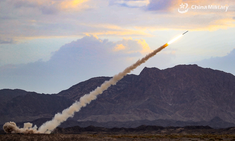 A wheeled long-range multiple launch rocket system (MLRS) attached to a brigade under the PLA 71st Group Army launches rockets at mock targets during a round-the-clock live-fire operation in northwestern China's Gobi desert on July 15, 2020. (eng.chinamil.com.cn/Photo by Wu Chaobing)
