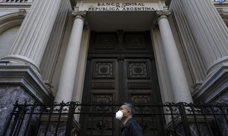 A man passes by the Central Bank of Argentina in Buenos Aires, Argentina, Aug. 4, 2020. The Argentine government confirmed on Tuesday that it has reached an agreement with its three main groups of private creditors and other minority bondholders to restructure a part of the country's foreign debt, valued at 66.2 billion U.S. dollars. (Photo by Martin Zabala/Xinhua)
