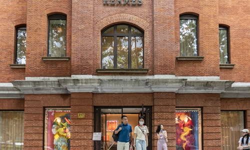 Consumers at a Hermes flagship store in Shanghai on Wednesday. The French luxury brand has seen increasing traffic in recent days as Chinese consumers release their pent-up consumption demand as the coronavirus ebbs. In the first half of 2020, global sales of Hermes dwindled 24 percent year-on-year to 2.488 billion euros ($2.96 billion). Photo: CNSphoto