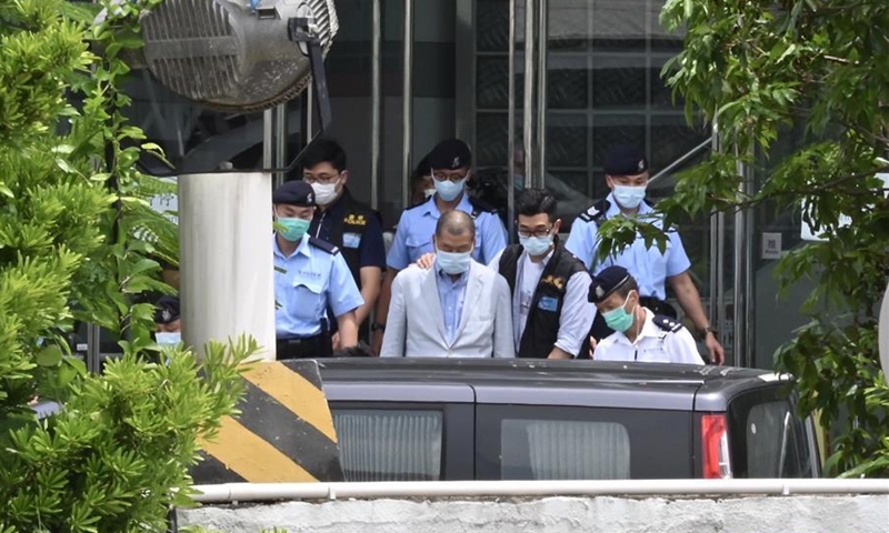 Jimmy Lai Chee-ying is taken by the police to the headquarters of Apple Daily for investigation in Hong Kong, south China, Aug. 10, 2020. (Xinhua/Lui Siu Wai)