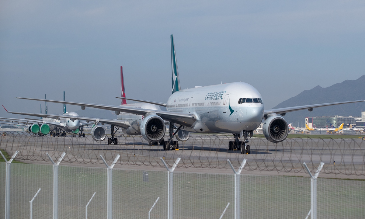 Cathay Pacific aircraft line up on the tarmac at the Hong Kong International Airport on April 30 as airlines across the globe have cancelled flights and postponed or adjusted services in response to the COVID-19 pandemic. Photo: AFP  