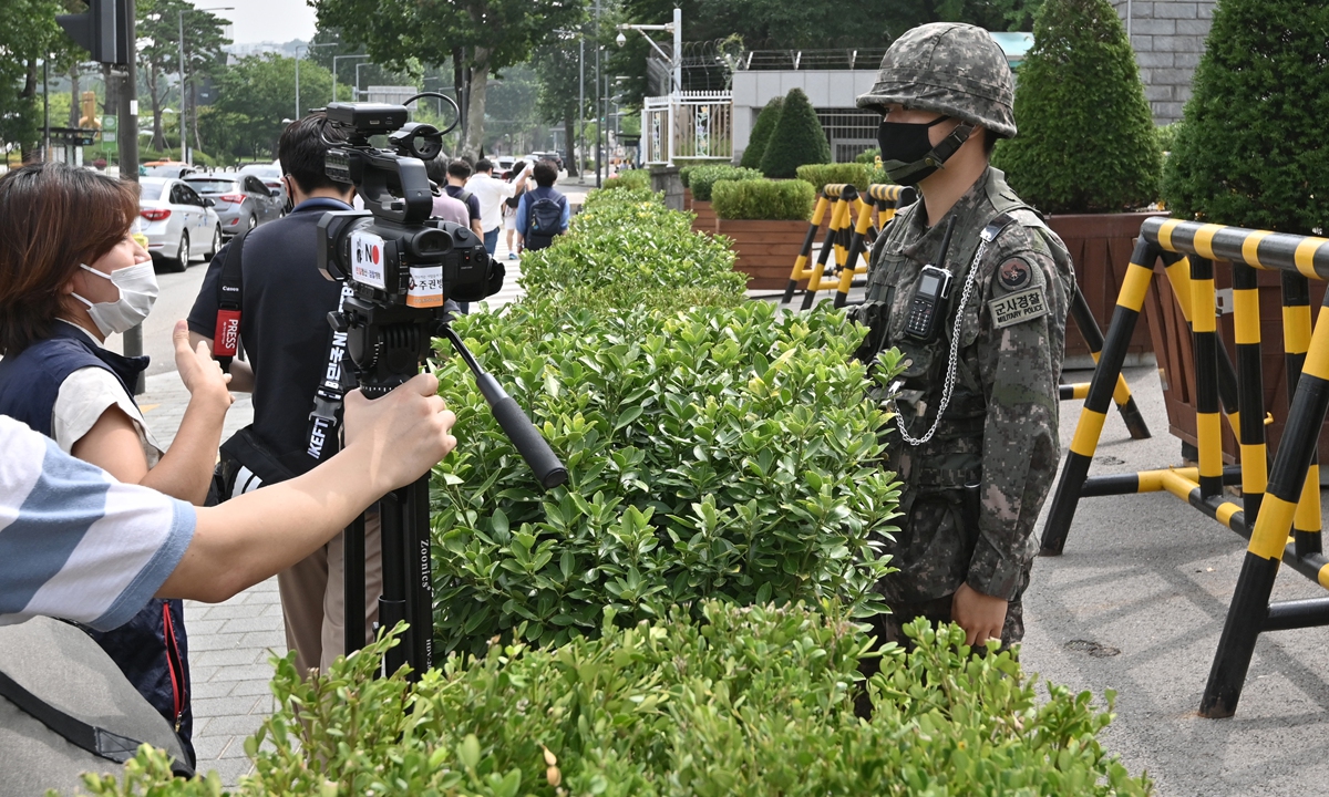 A South Korean soldier stands guard at the main gate of the Defense Ministry in Seoul on Tuesday, as protesters hold a rally opposing a joint military exercise between South Korea and the US. The two countries began annual military exercises on Monday following a coronavirus delay, with the drills likely to infuriate the North which sees them rehearsals for invasion. Photo: AFP