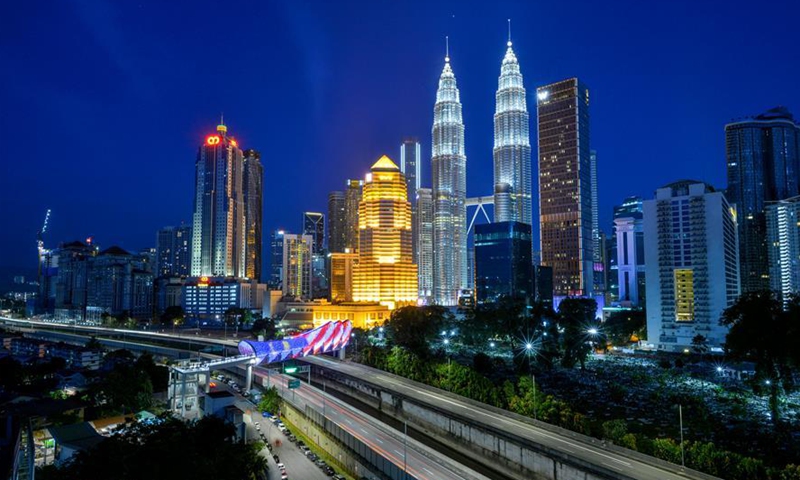 Photo taken on Aug. 8, 2020 shows a night view of Kuala Lumpur, Malaysia. Kuala Lumpur is the capital and largest city of Malaysia. Developing from a tin-mining town, the city is now widely recognised for numerous landmarks, including the Petronas Twin Towers. The combination of skyscrapers and historical sites and the harmonious coexistence of diversified cultures add to the city a special charm of its own. (Photo by Chong Voon Chung/Xinhua)