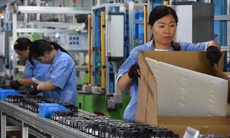 Employees work at a workshop of an electrical machinery company in Huzhou, east China's Zhejiang Province, Sept. 3, 2020. In the first half of the year, Huzhou realized a GDP of 145.3 billion yuan(about 21.2 billion U.S. dollars), up 0.5% year on year. The total fiscal revenue reached 37.73 billion yuan(about 5.5 billion U.S. dollars), up 3% year-on-year. (Xinhua/Zheng Mengyu)